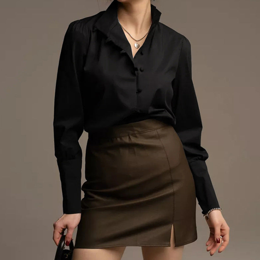 Damebluse med høj ståkrave og elegante pufærmer Stilla