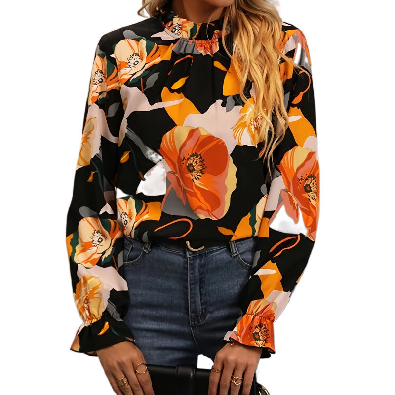 Damebluse med blomsterprint og flæseudskæring i lange ærmer Stilla