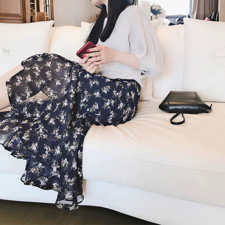 Dame luftigt Maxiskørt med floralt design og asymmetrisk snit Stilla