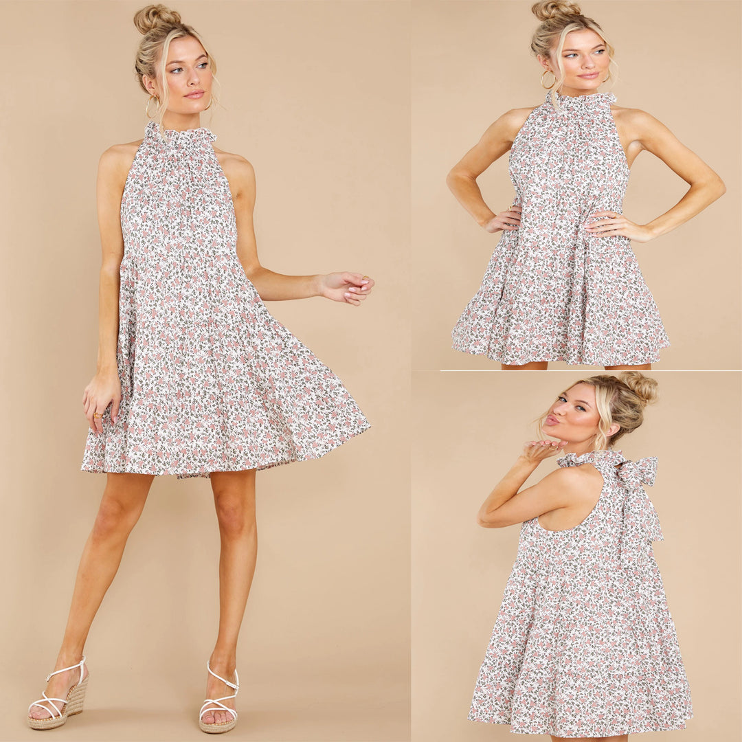 Women's halter dress with playful floral design and ruffle details