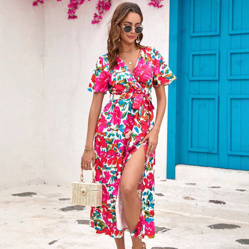 Dame maxikjole med floral wrap-design og sidelæns split Stilla