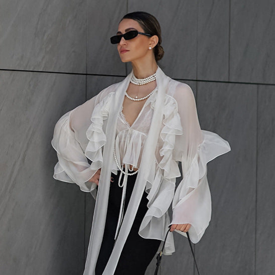 Dame Transparent Rynkebluse med voluminøse ærmer og elegant design Stilla