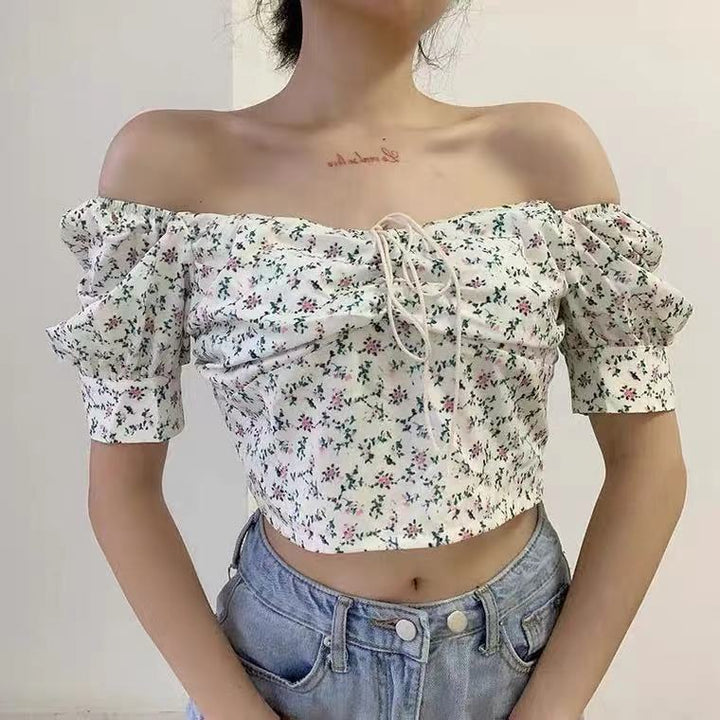 Kvindernes crop top med puffærmer og blomstermotiv