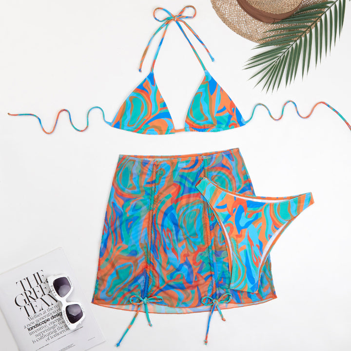 Dame trendy triangel-bikini-sæt med halvtransparent indpakningsskørt og farverigt mønster Stilla