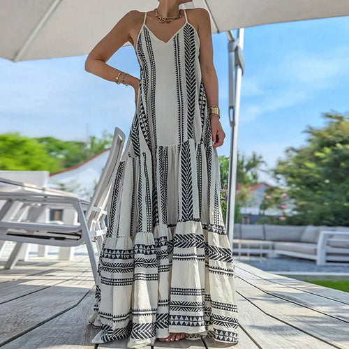 Stilla | Elegante, Ærmeløs Kjole Med Flæser Og Afslappet Print