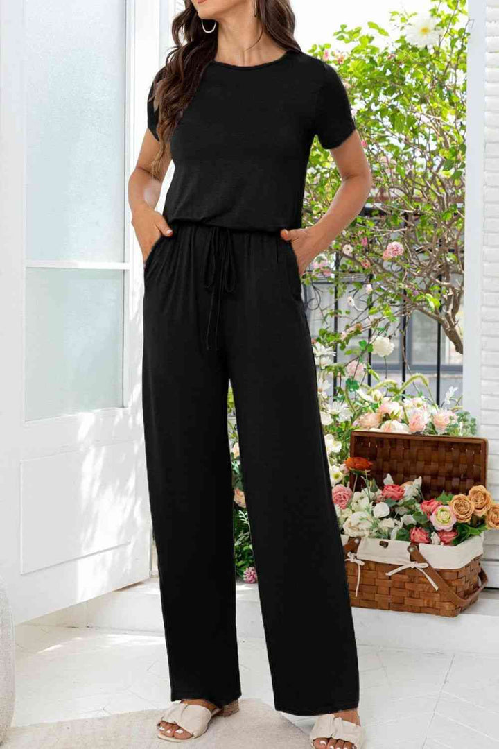 Stilla | Hals Åben Bag Jumpsuit Med Lommer