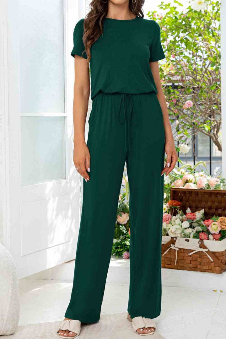 Stilla | Hals Åben Bag Jumpsuit Med Lommer