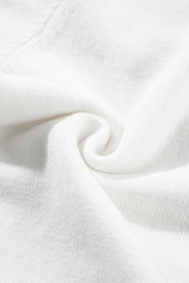Stilla | Behagelig, blomsterinspireret sweater med korte ærmer